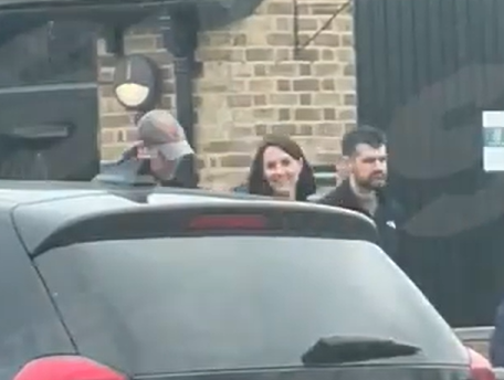 Kate laughed as she chatted with William on the walk out of the shop