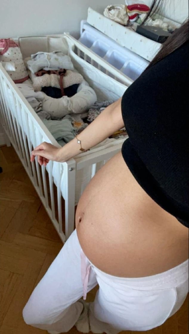 A selfie taken by Saga shows her pregnant standing next to a lovingly-made crib in her bedroom, ready for the arrival of her baby son Esaiah