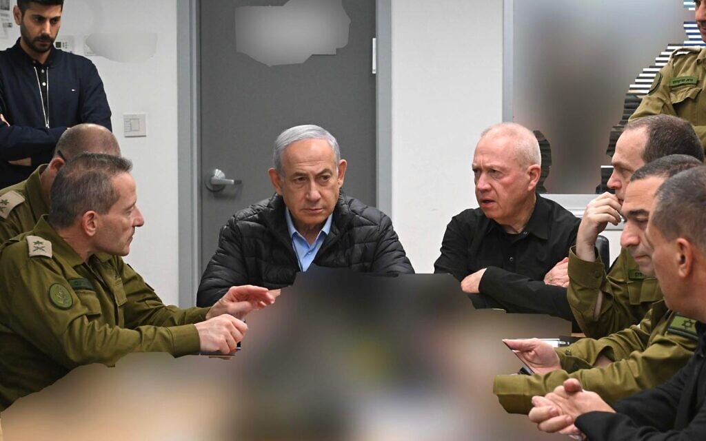 A handout photo released by his office on October 26, 2024, shows Prime Minister Benjamin Netanyahu meeting with Defense Minister Yoav Gallant and IDF commanders in the bunker below the Kirya military base in Tel Aviv. (Avi Ohayun/GPO)