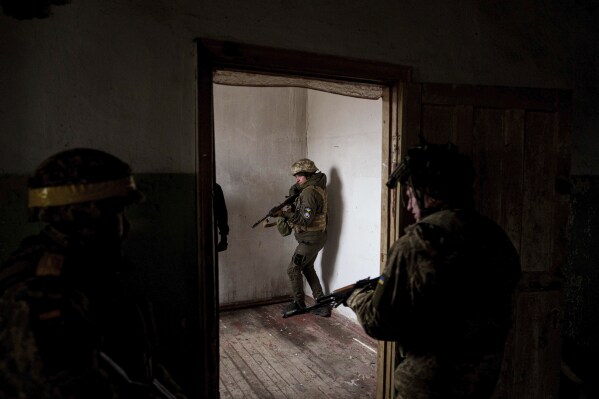 Ukrainian soldiers of Da Vinci Wolves Battalion train not far from the frontline on Pokrovsk direction, Donetsk region, Ukraine, Jan. 29, 2025. (AP Photo/Evgeniy Maloletka)
