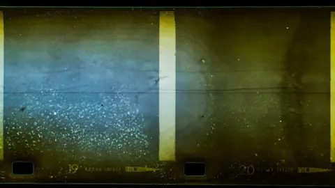 NOC The shot shows a structure through the gloom of the loch's waters