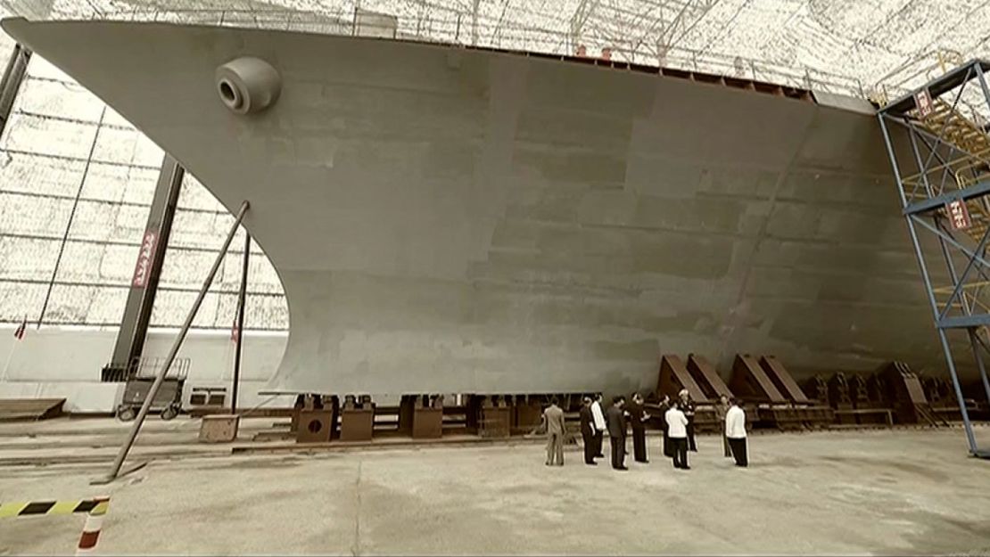 An image from Korean Central Television shows leader Kim Jong Un checking the work on a new warship late last year.